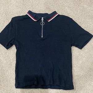 This is a crop top that has a circle zipper and is very fitting